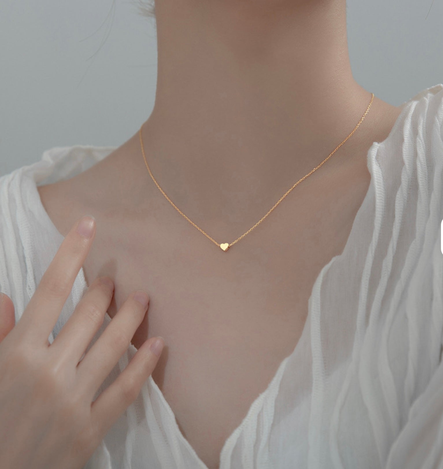 Necklace with Heart charm.