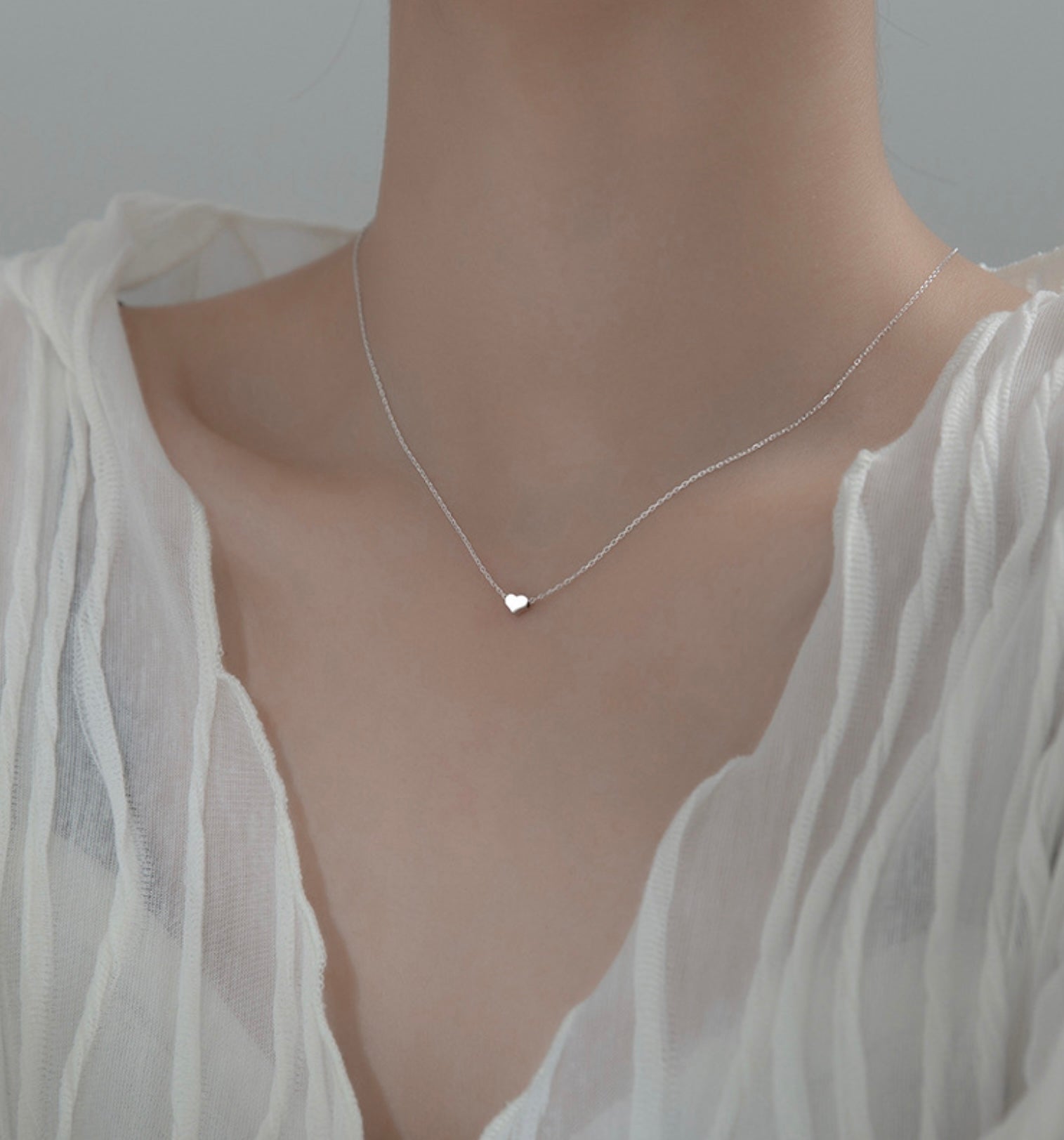 Necklace with Heart charm.