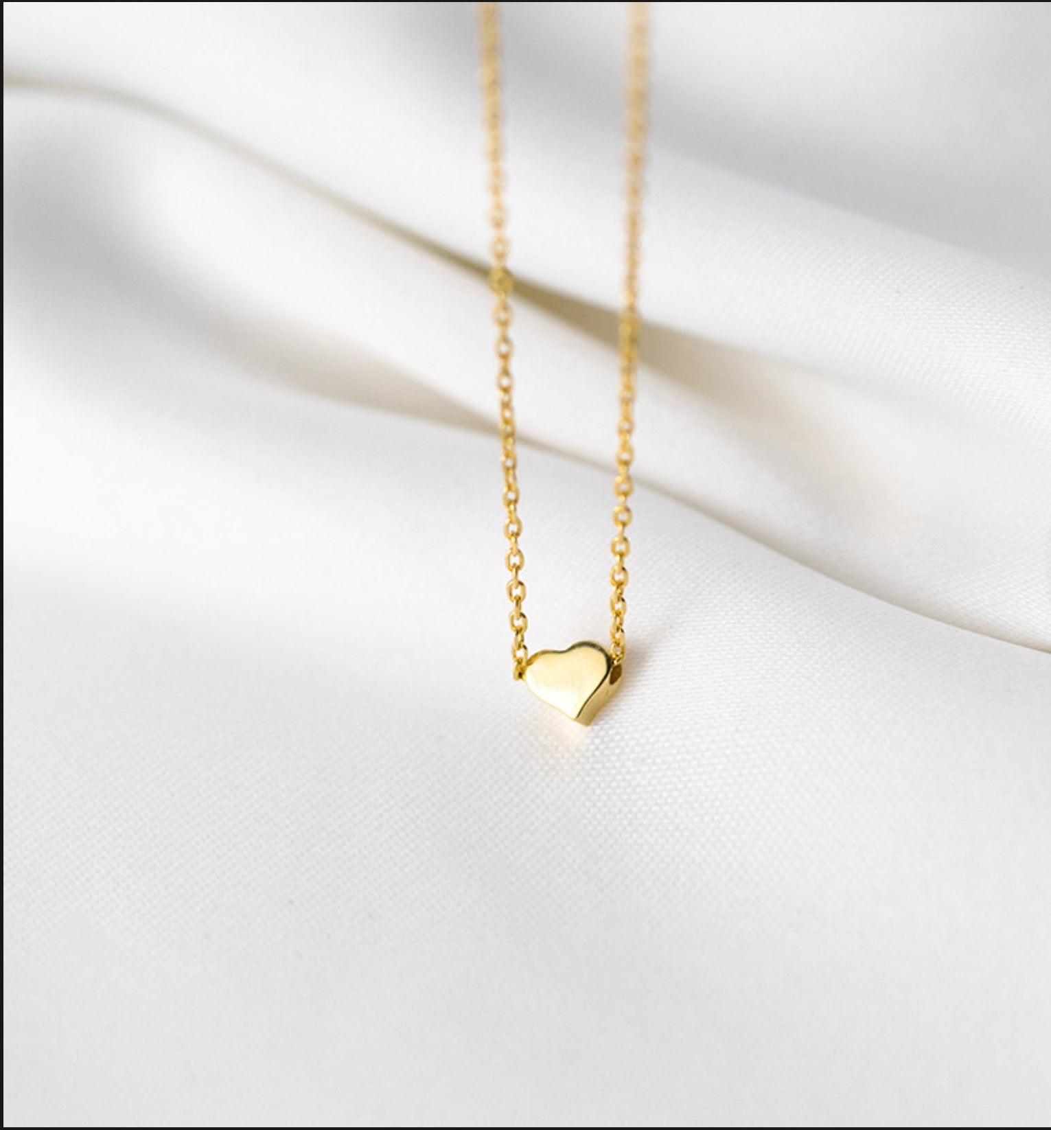 Necklace with Heart charm.