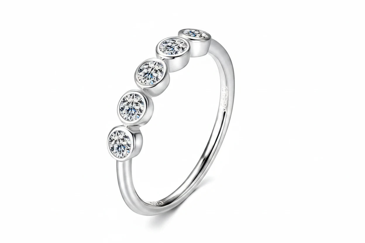 Silver ring with five clear gemstones on a white background, featuring the Chasau brand.