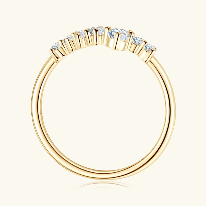 Gold ring with small diamonds on a white background