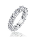 Silver ring with clear gemstones on a white background