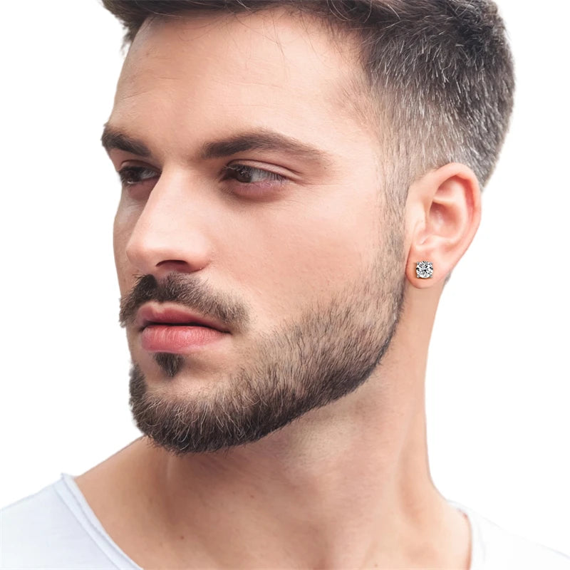 Man with a beard wearing a diamond earring on a white background