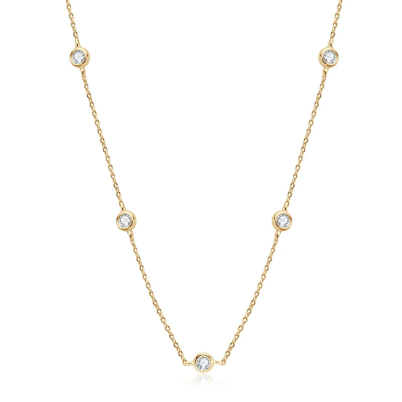 Gold necklace with small diamonds on a white background