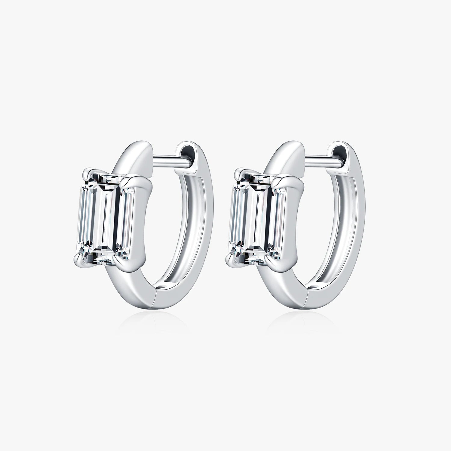 Pair of silver hoop earrings with baguette-cut gemstones on a white background
