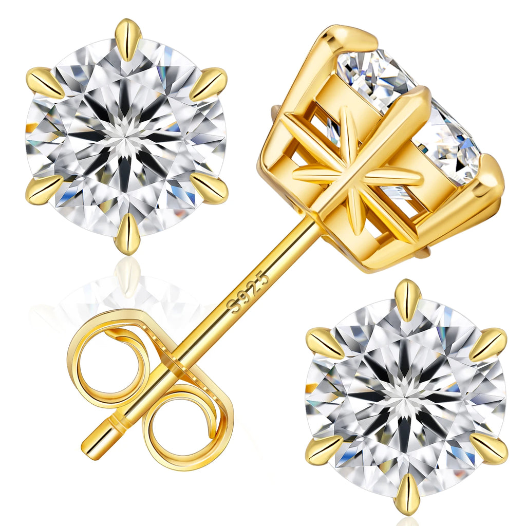 Gold stud earrings with clear gemstones on a white background