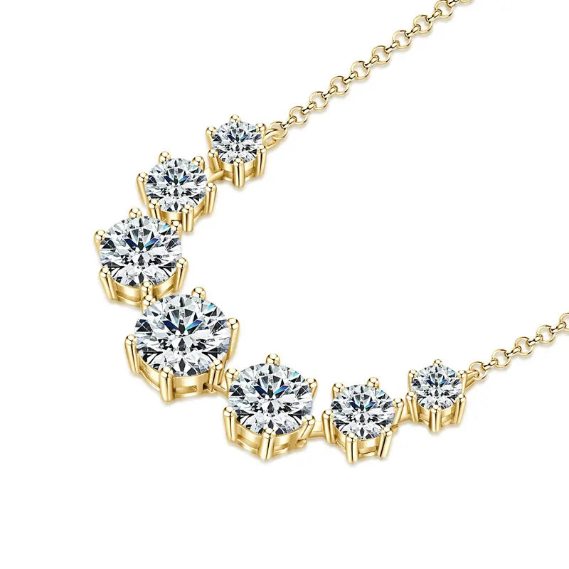 Silver necklace with floral design on a white background, featuring the brand 