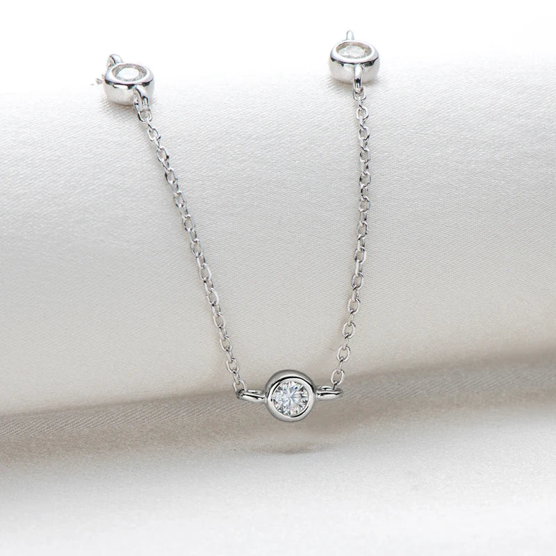 Silver necklace with a diamond pendant on a white background