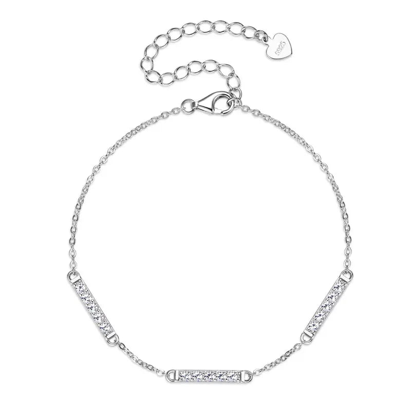Silver bracelet with heart clasp on a white background