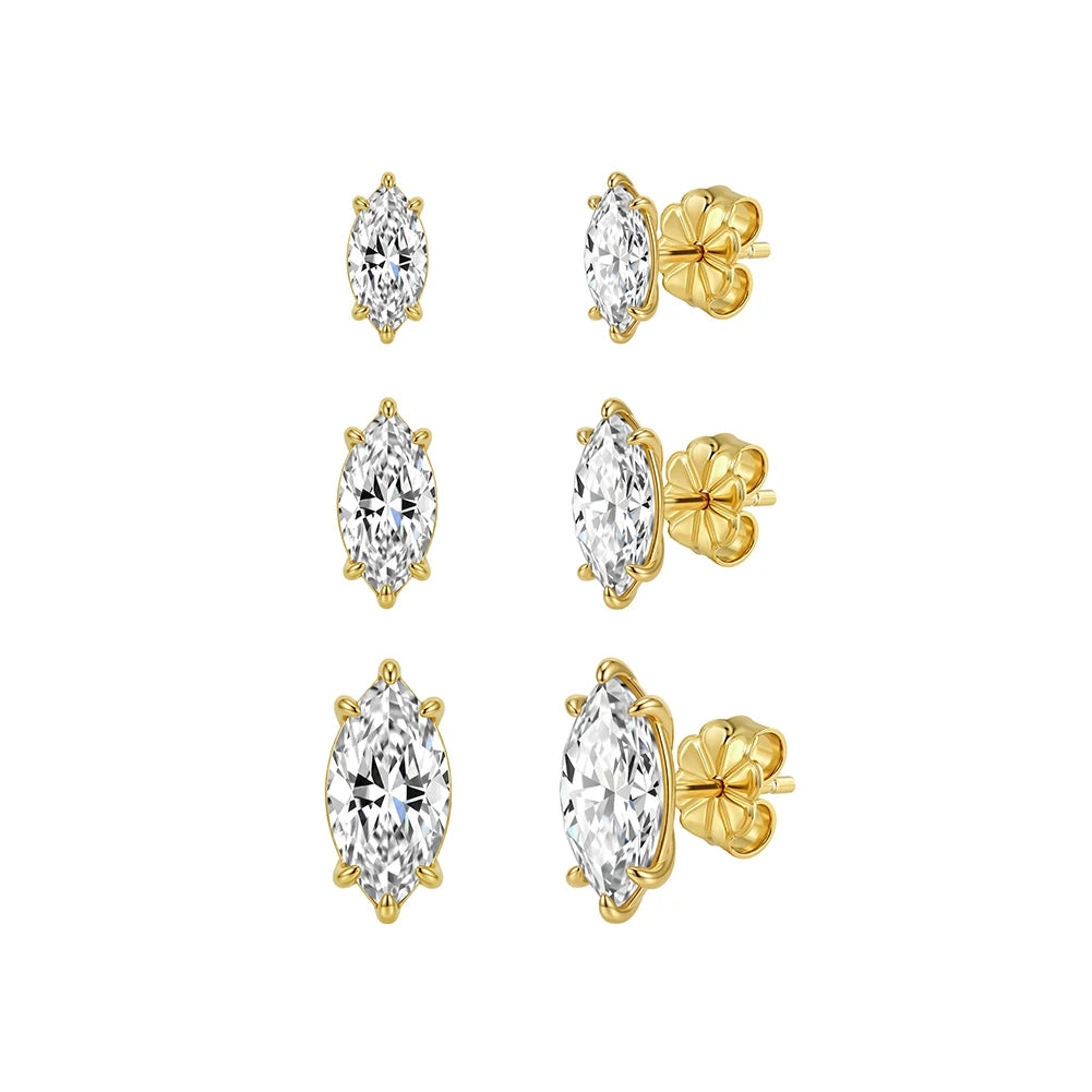 Gold stud earrings with clear gemstones on a white background