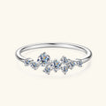 Silver ring with diamond-like crystals on a white background