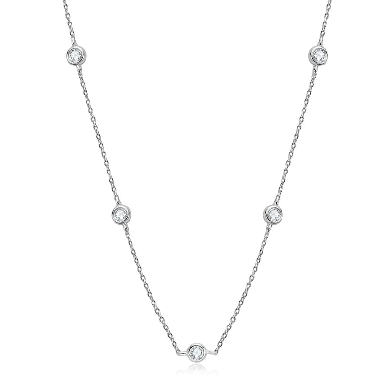 Silver necklace with small round pendants on a white background
