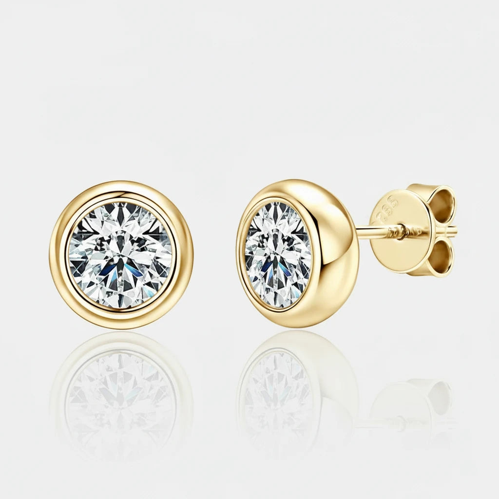Gold earrings with clear gemstones on a white background, featuring the Chasau brand.