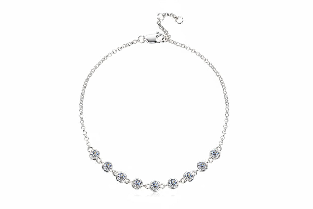 Silver necklace with clear stones on a white background, featuring the Chasau brand.