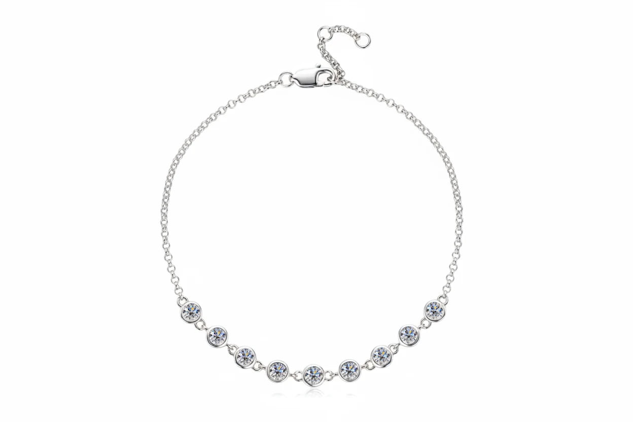 Silver necklace with clear stones on a white background, featuring the Chasau brand.
