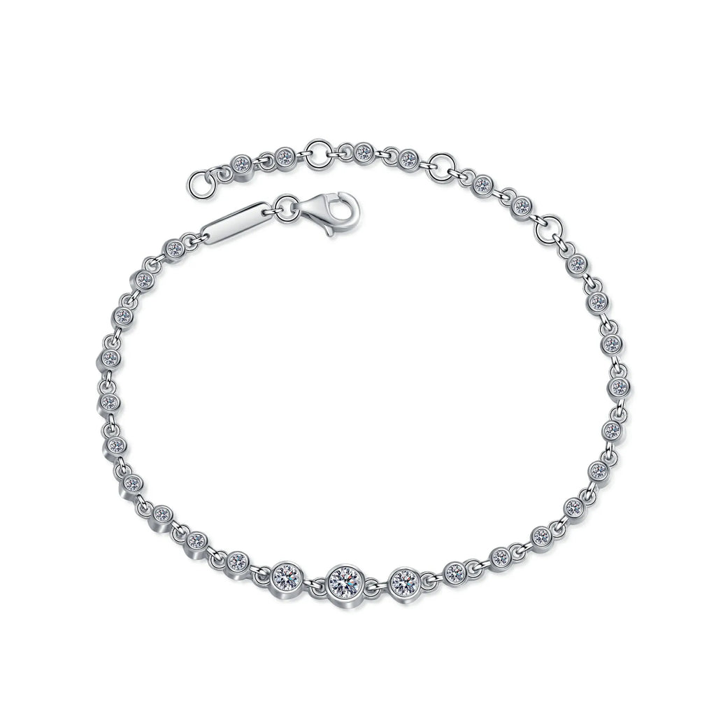 Silver bracelet with diamond accents on a white background