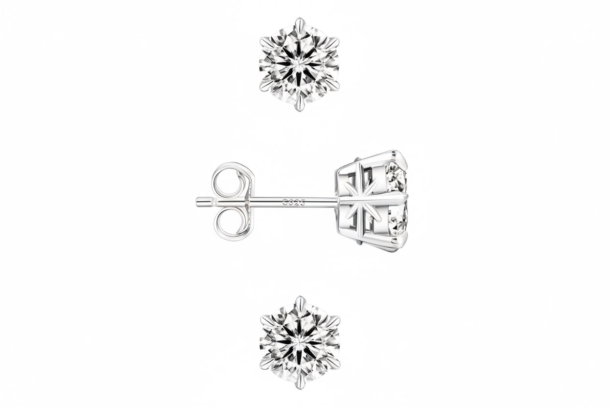 Pair of silver stud earrings with clear gemstones on a white background