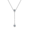 Silver necklace with two round Moissanite on a white background